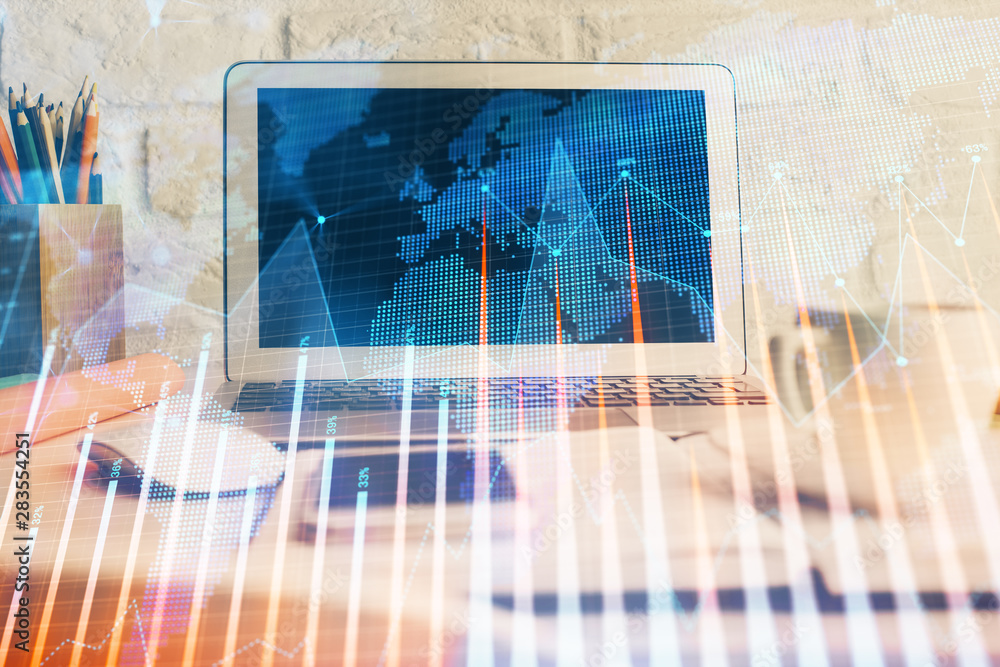 Forex market graph hologram and personal computer on background. Double exposure. Concept of investment. Forex market graph hologram and personal computer on background. Double exposure. Concept of investment.