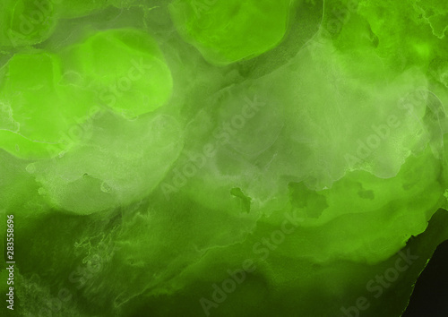 Hand painted alcohol ink background. Abstract delicate green texture. Contemporary wallpaper. 