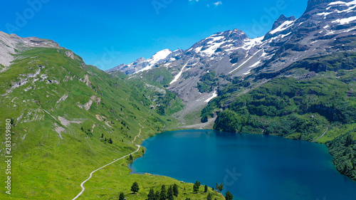 Romantic mountain lake in the Swiss Alps - amazing Switzerland from above