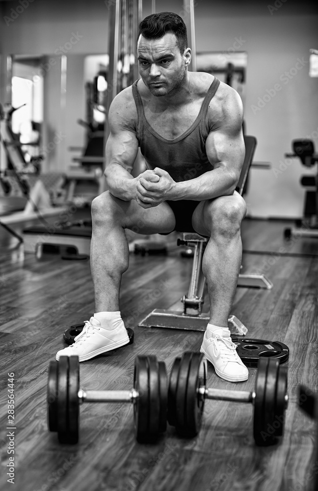 Fototapeta Athletic man preparing for workout