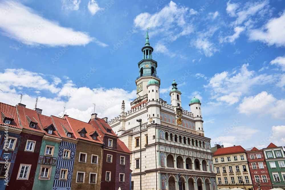 Old market with Renaissance town hall tower and historic tenements in Poznan. Old market with Renaissance town hall tower and historic tenements in Poznan.