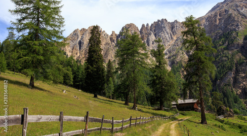 Photos view over the Karer See to the mountain range Latemar