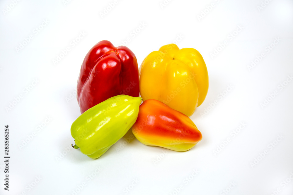 Sweet bell pepper red yellow green isolated on white background. Useful vegetables and fruits. Food drinks. Sweet bell pepper red yellow green isolated on white background. Useful vegetables and fruits. Food drinks.