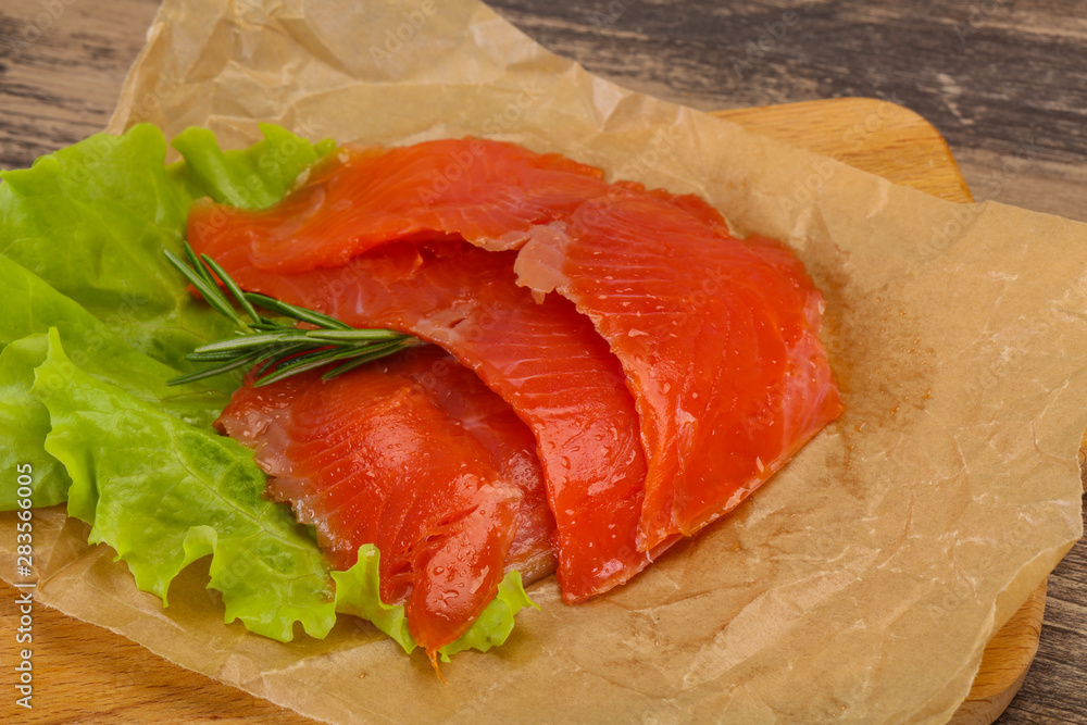 Sliced salmon fillet served rosemary Sliced salmon fillet served rosemary