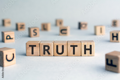 Konstfotografi Truth - word from wooden blocks with letters, real facts truth  concept, random