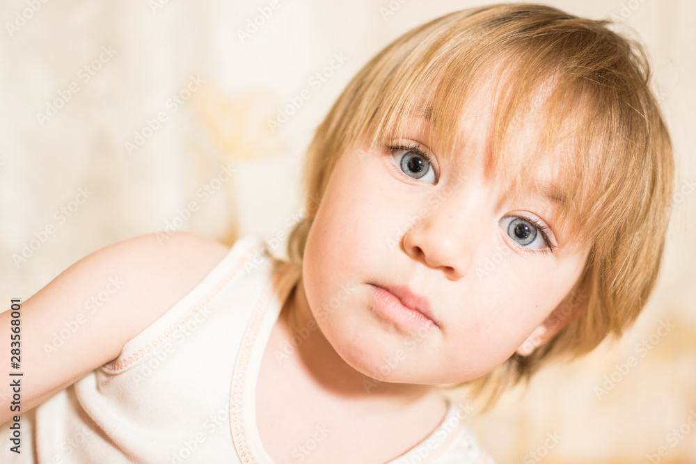 Portrait of little child with beautiful eyes and blond hair. Portrait of little child with beautiful eyes and blond hair.