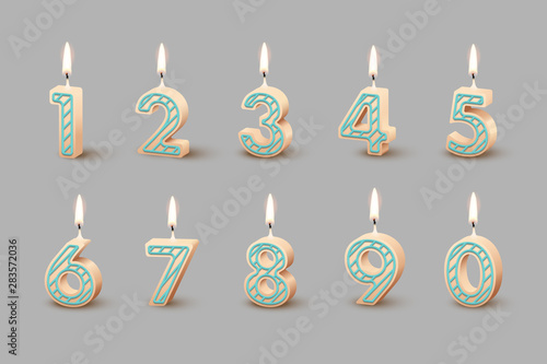 Birthday candles with burning flames isolated on gray background. Vector design elements.