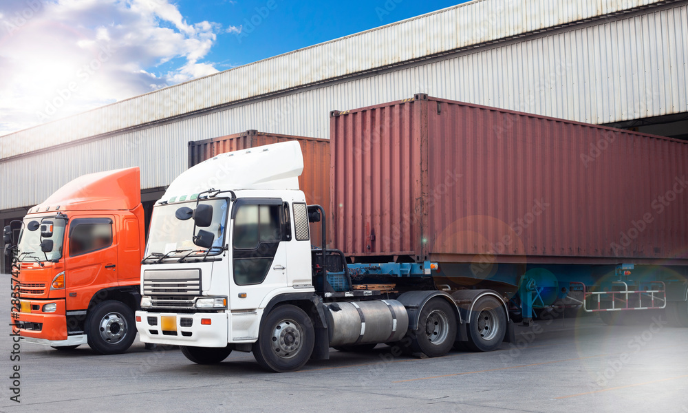 freight transportation, trucks trailer docking at distribution warehouse