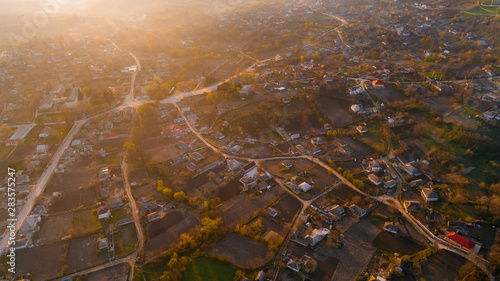 A picturesque village at sunrise, shot from above.