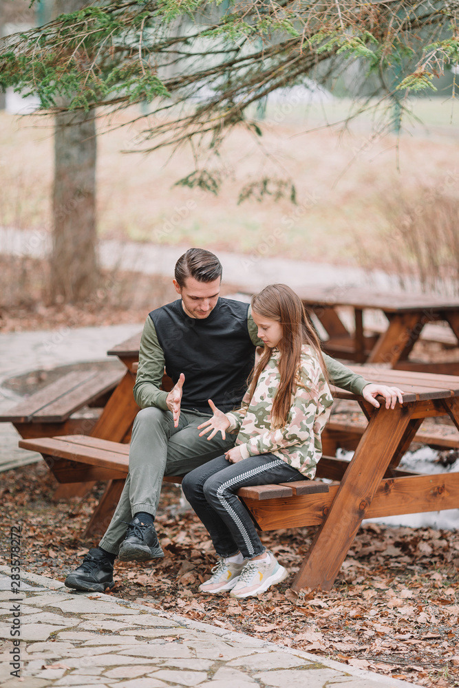 Obraz premium Father and cute daughters with dog outdoors