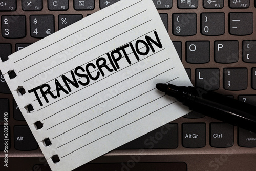 Text sign showing Transcription. Conceptual photo Written or printed version of something Hard copy of audio Notebook piece paper keyboard Inspiration ideas Type computer black marker