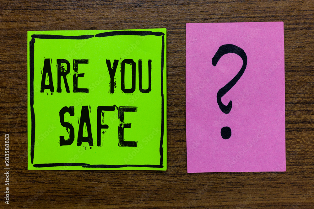 Handwriting text Are You Safe. Concept meaning Free from danger Not anticipating any Harm Hurt physically Green paper note Important reminder pink question mark wooden background Handwriting text Are You Safe. Concept meaning Free from danger Not anticipating any Harm Hurt physically Green paper note Important reminder pink question mark wooden background