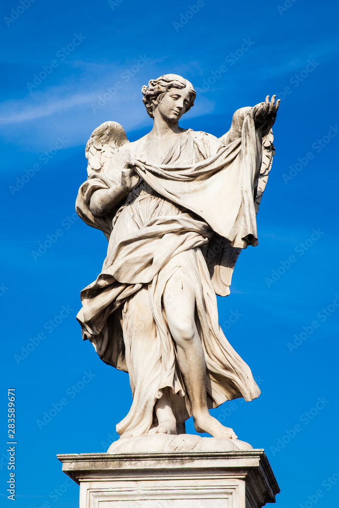 Beautiful Angel with the Sudarium statue created by Cosimo Fancelli on the 16th century at Sant Angelo Bridge in Rome