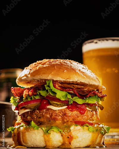 Close-up hamburger with glass of beer