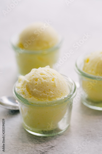 Yellow ice cream served in glass