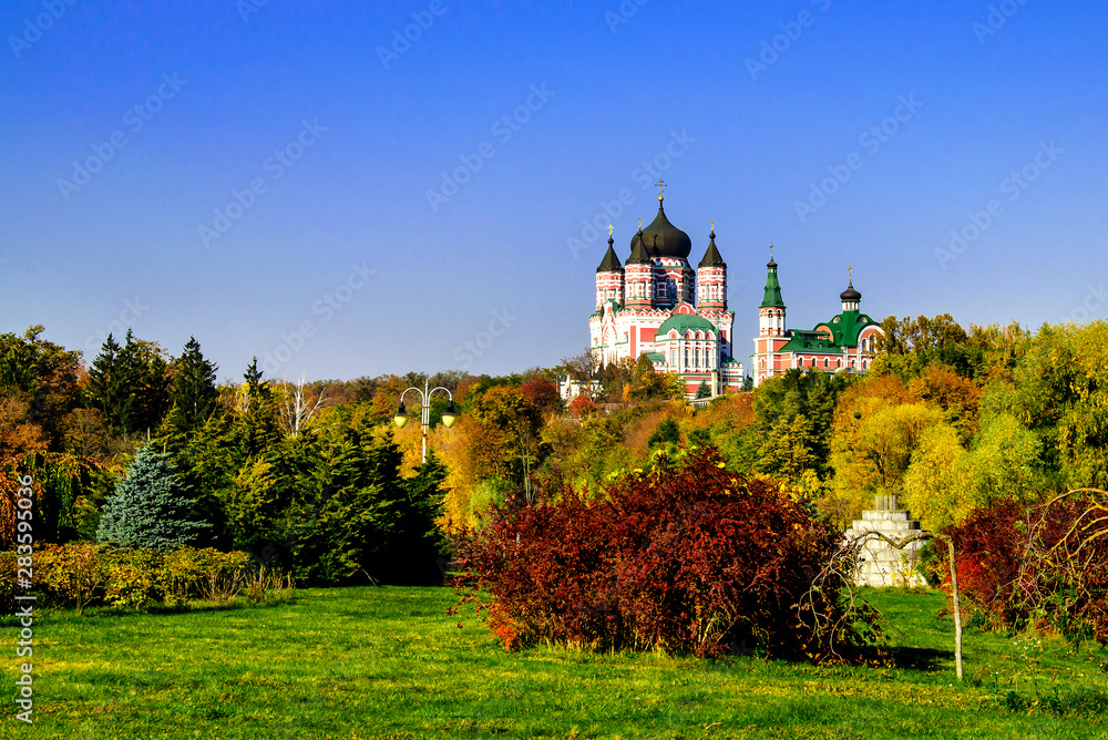 beautiful Orthodox church surrounded by trees in warm autumn afternoon ,Panteleimon Church in Kiev Ukraine,