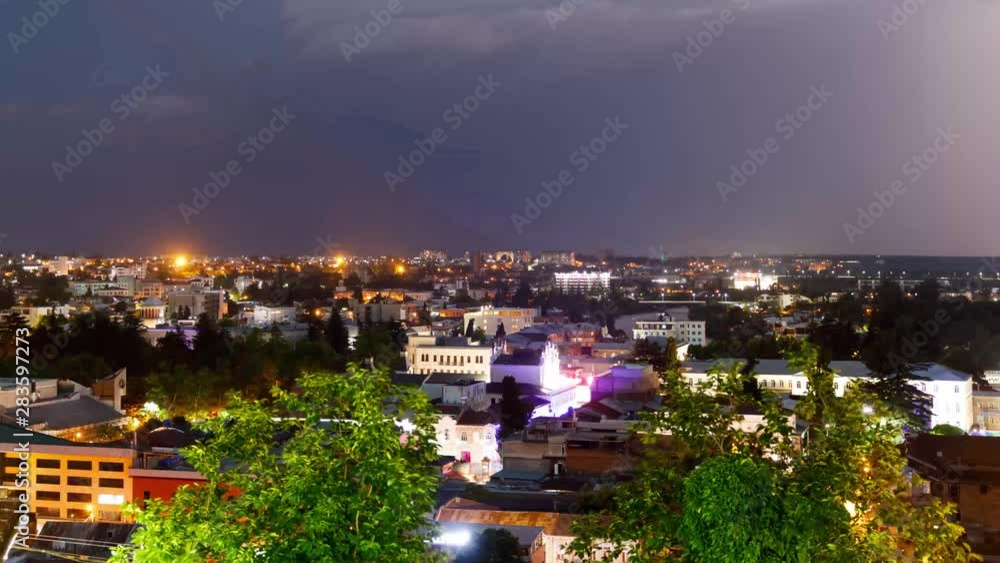timelapse with Panoramic summer view of the city of Kutaisi, Georgia. River Rioni and old houses with Red roofs. night thunderstorm over Kutaisi and Mountains in the distance. timelapse with Panoramic summer view of the city of Kutaisi, Georgia. River Rioni and old houses with Red roofs. night thunderstorm over Kutaisi and Mountains in the distance.