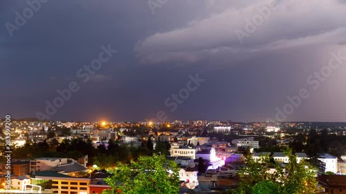 Wallpaper Mural timelapse with Panoramic summer view of the city of Kutaisi, Georgia. River Rioni and old houses with Red roofs. night thunderstorm over Kutaisi and Mountains in the distance. Torontodigital.ca