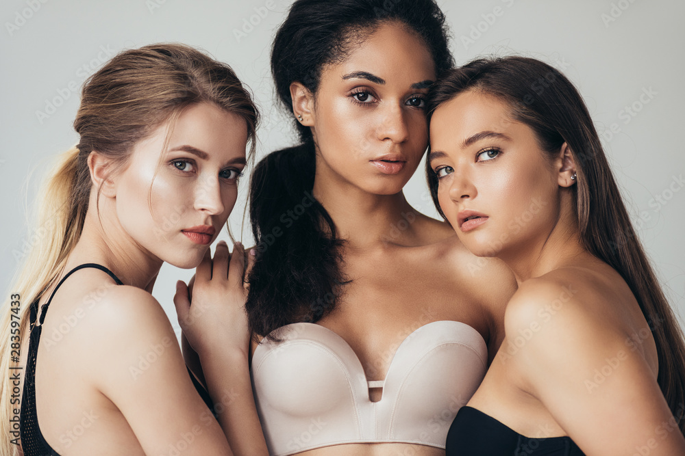 Three Attractive Middle Aged Women In Underwear Embracing Each