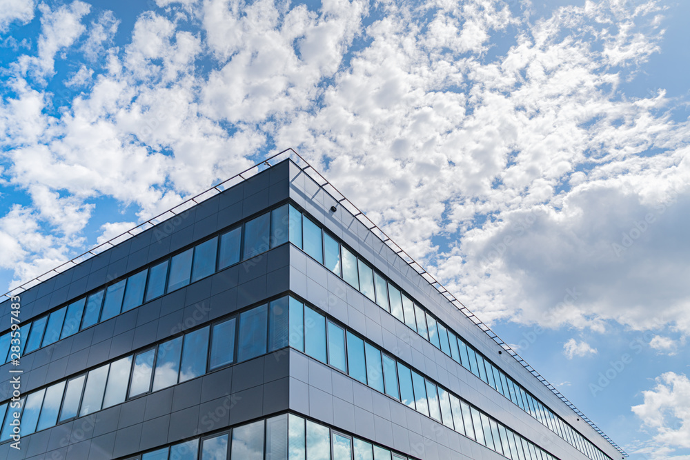 Modern office buildings in the background of the sky with clouds. Modern office buildings in the background of the sky with clouds.
