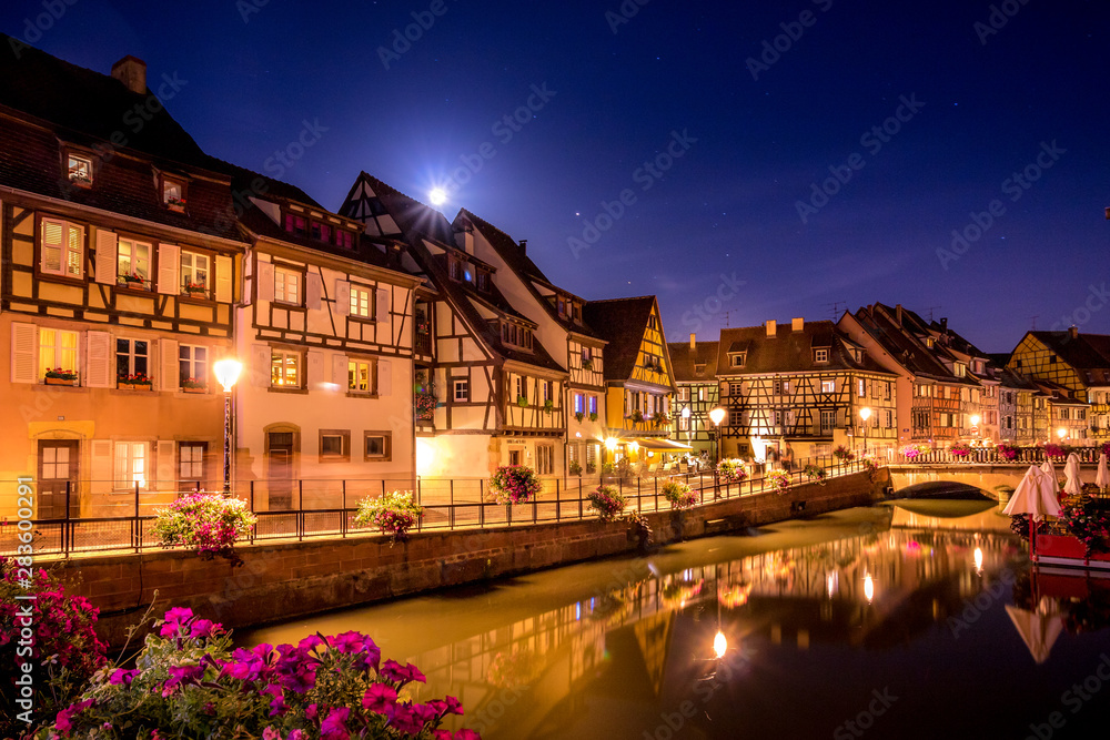 colorful night view of Colmar, Alsace, France with flowers