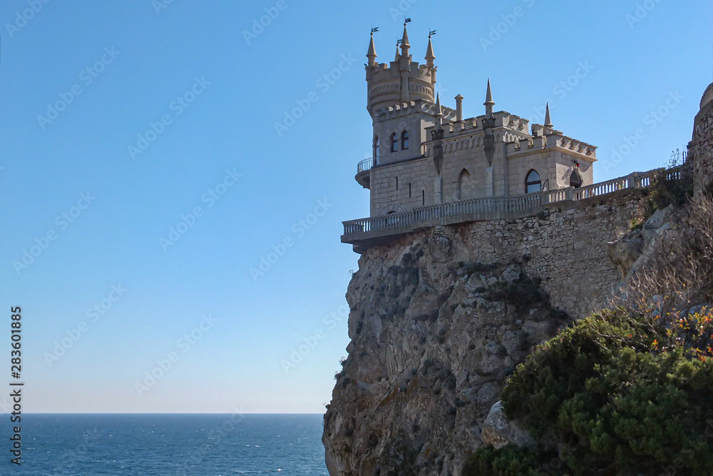 Castle Swallow's Nest on rock Aurora Cliff in Black Sea in Gaspra. Symbol and landmark of Crimea, Russia. One of main tourist places of Crimea Swallow's Nest was built in 1912