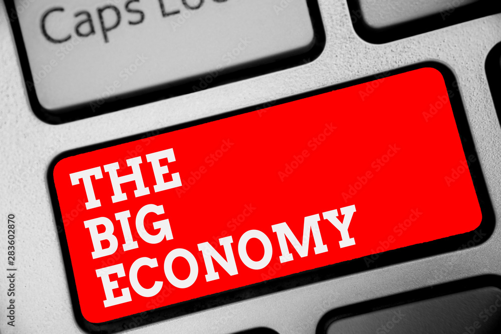 Word writing text The Big Economy. Business concept for Global finances Worldwide Market Trade Money exchange Keyboard red key Intention create computer computing reflection document