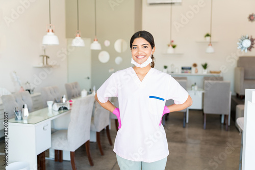 Self-Assured Salon Worker Smiling In Uniform photo