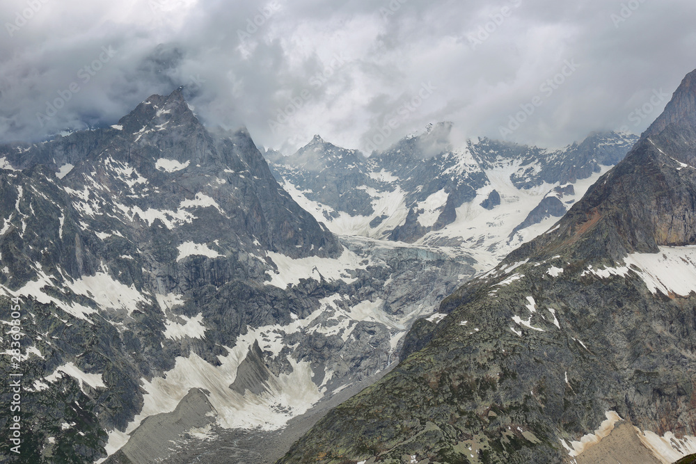 View of mountain peaks with glaciers in Val Ferret, Aosta valley, Italy