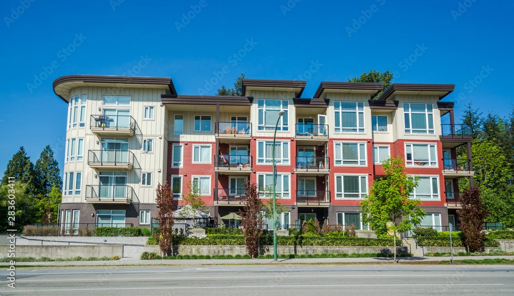 New apartment building on sunny day in British Columbia, Canada.