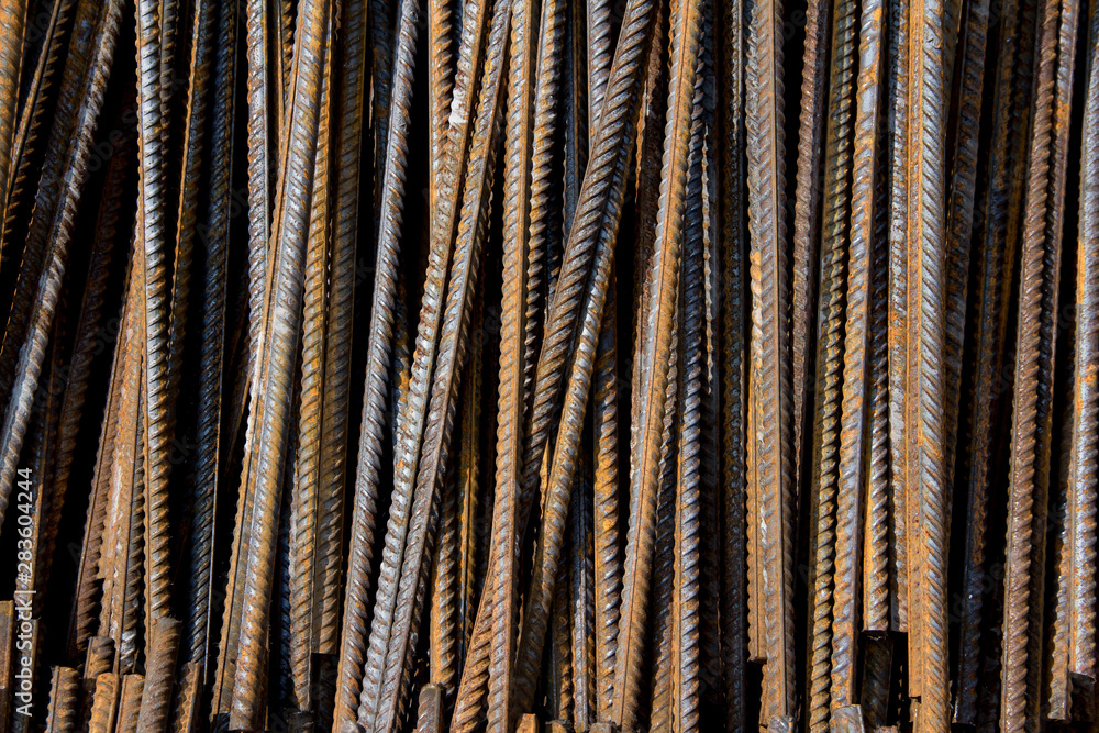Industrial background. Rebar texture. Rusty rebar for concrete pouring. Steel reinforcement bars. Construction rebar steel work reinforcement. Closeup of Steel rebars. Industrial background. Rebar texture. Rusty rebar for concrete pouring. Steel reinforcement bars. Construction rebar steel work reinforcement. Closeup of Steel rebars.