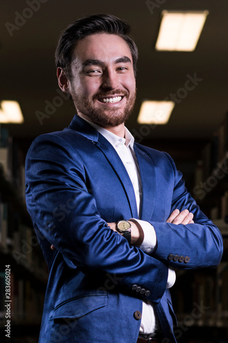 portrait of a man in suit in the library