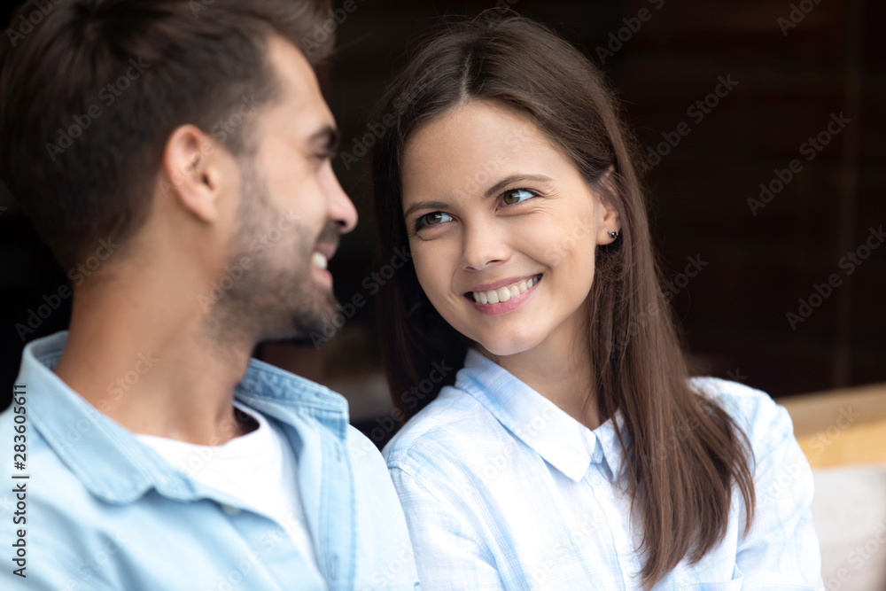 Happy young family look in eyes reconciled after split