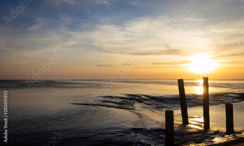 Fototapeta Naklejka Na Ścianę i Meble -  Sunset at low tide over Waddenzee, Netherlands