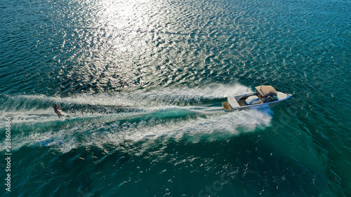 Canvas Print Aerial photo of extreme power boat donut water-sports cruising in high speed in
