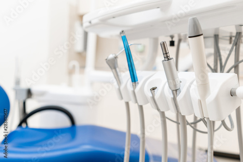 Close-up dental high speed turbine. Dental work in clinic. Operation  tooth replacement. Medicine  health  stomatology concept. Office where dentist conducts inspection and concludes.