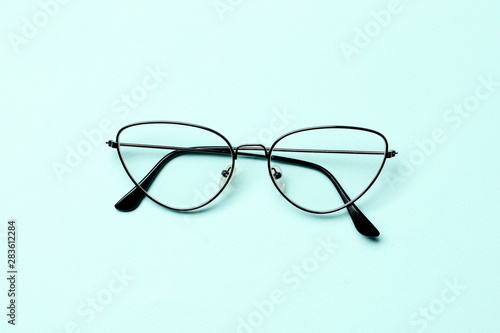 Glasses on a blue background with place for text.