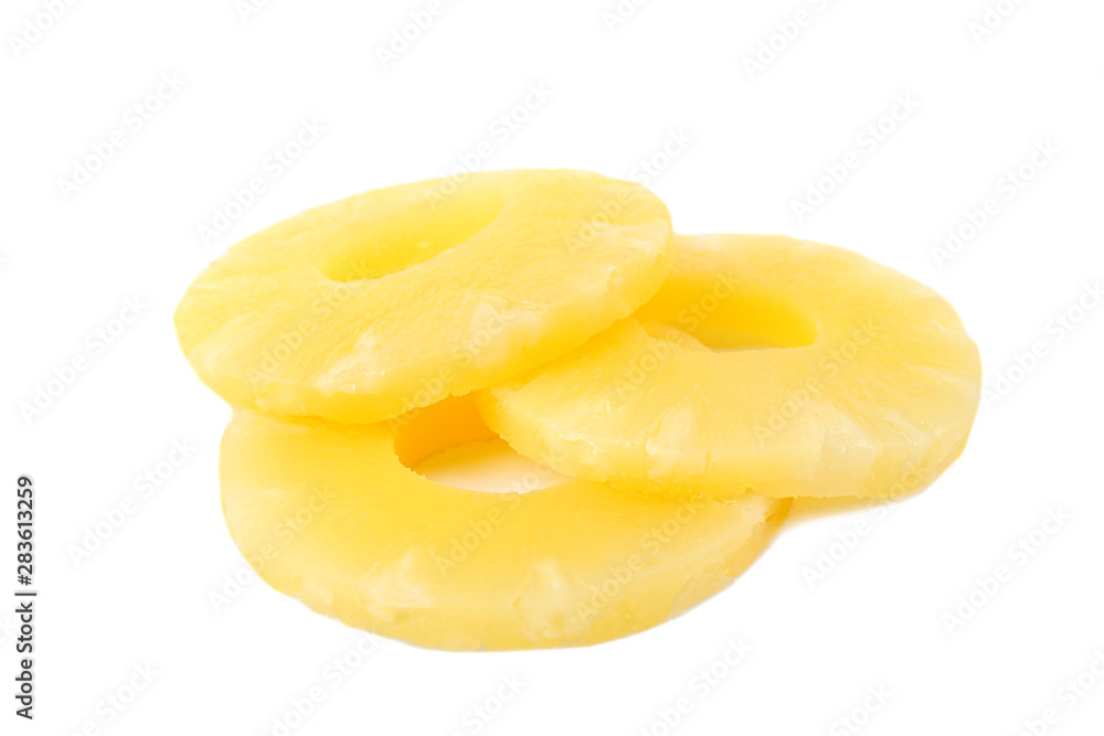 Slices of delicious sweet canned pineapple on white background