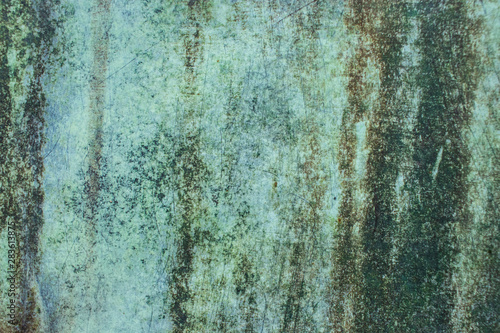 Green grunge painted wall surface worn weathered dirty old rough vintage background surface texture