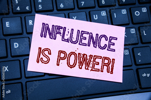 Handwriting Announcement text showing Influence Is Power. Business concept for Persuasion Strategy written on sticky note paper on black keyboard background.