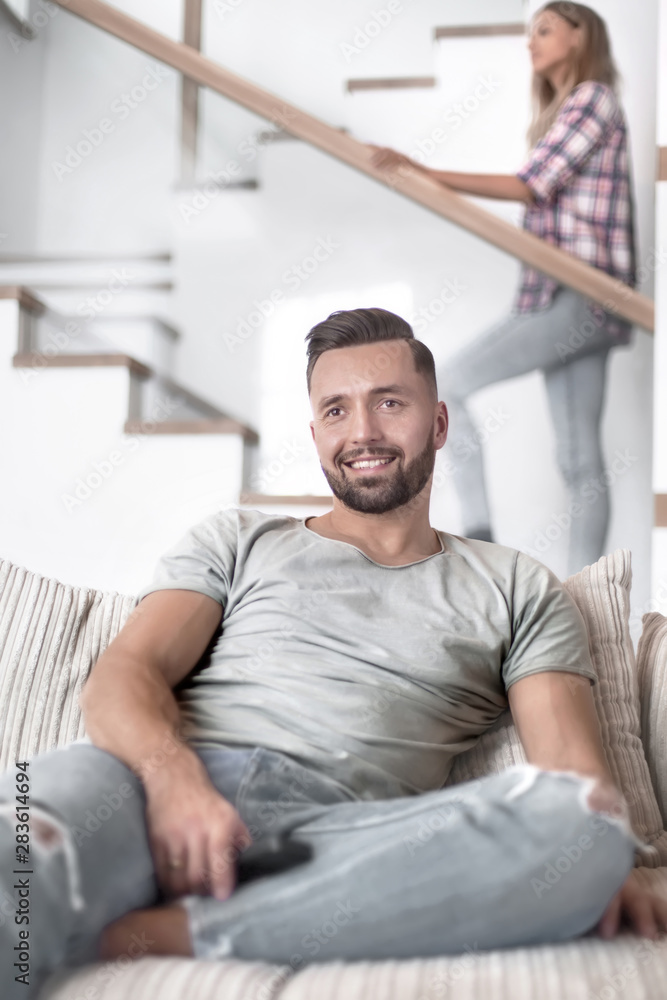 close up. young man sitting on sofa. close up. young man sitting on sofa.