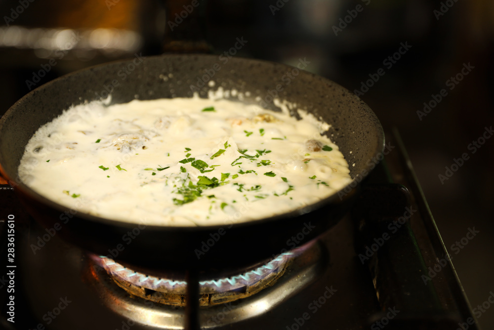 Cooking delicious noodles with melted cheese on frying pan Cooking delicious noodles with melted cheese on frying pan