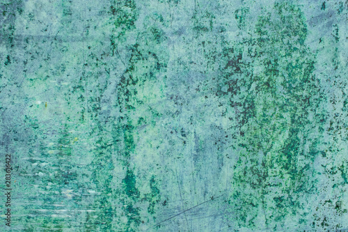 Green grunge painted wall surface worn weathered dirty old rough vintage background surface texture