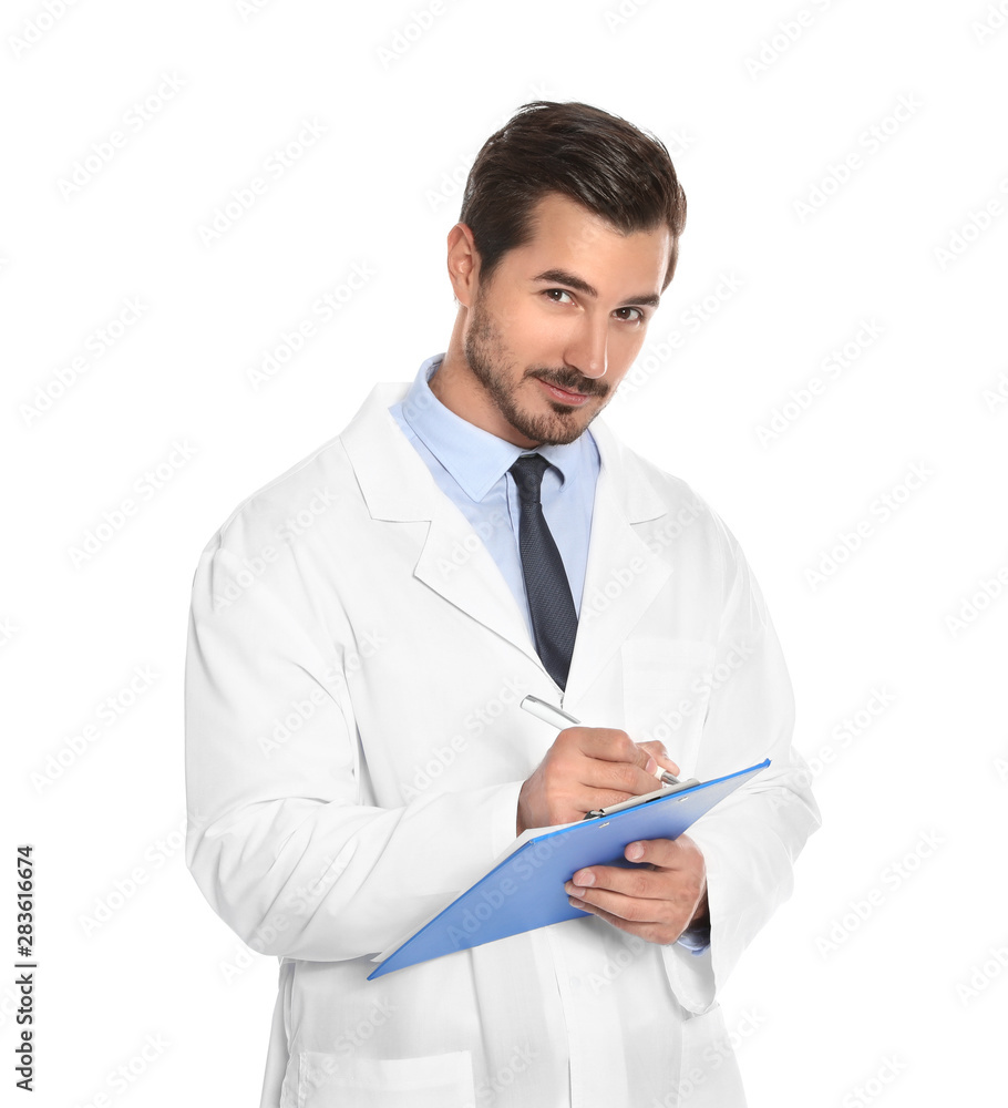 Young male doctor writing on clipboard against white background. Medical service Young male doctor writing on clipboard against white background. Medical service