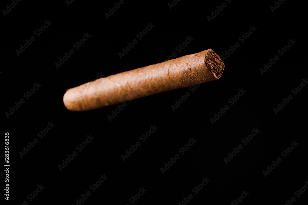 handmade cigar on black background handmade cigar on black background