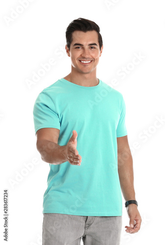 Professional business trainer offering handshake on white background © New Africa