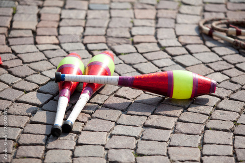 multicolored juggling stick on a cobbled street in a soft backlight77 photo