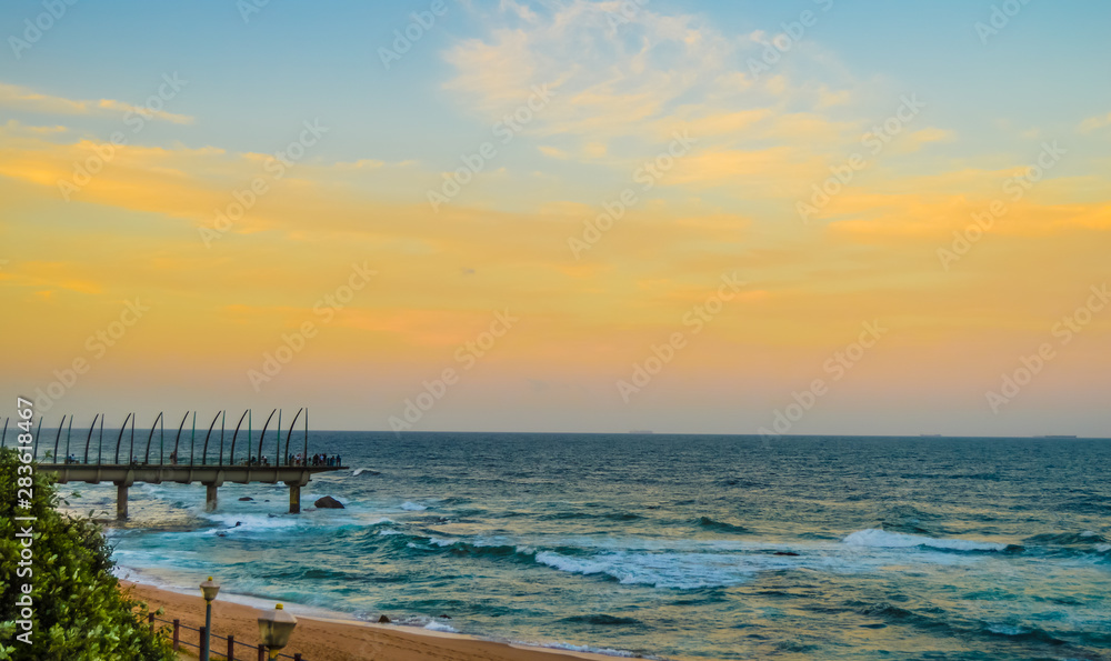 Beautiful Umhlanga Promenade Pier a whalebone made pier in Kwazulu Natal Durban North South Africa during sunset Beautiful Umhlanga Promenade Pier a whalebone made pier in Kwazulu Natal Durban North South Africa during sunset