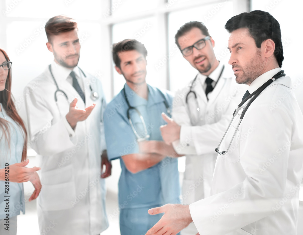 group of medical staff is discussing in the corridor of the clinic group of medical staff is discussing in the corridor of the clinic