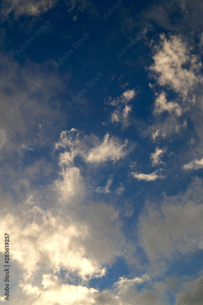 Large white cumulus clouds on a blue sky for background or ecology or nature. Large white cumulus clouds on a blue sky for background or ecology or nature.